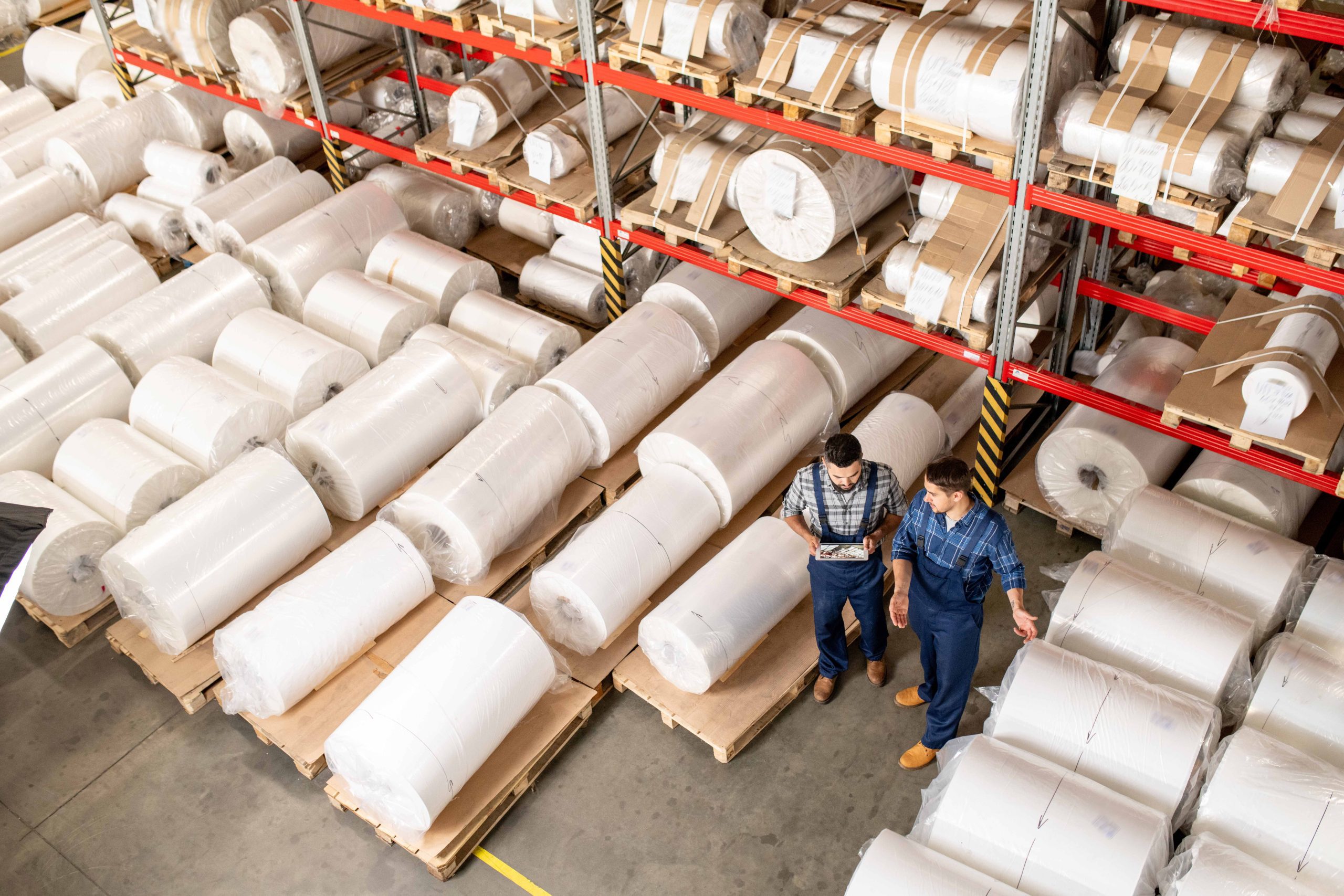 workers next to industrial plastic wrap